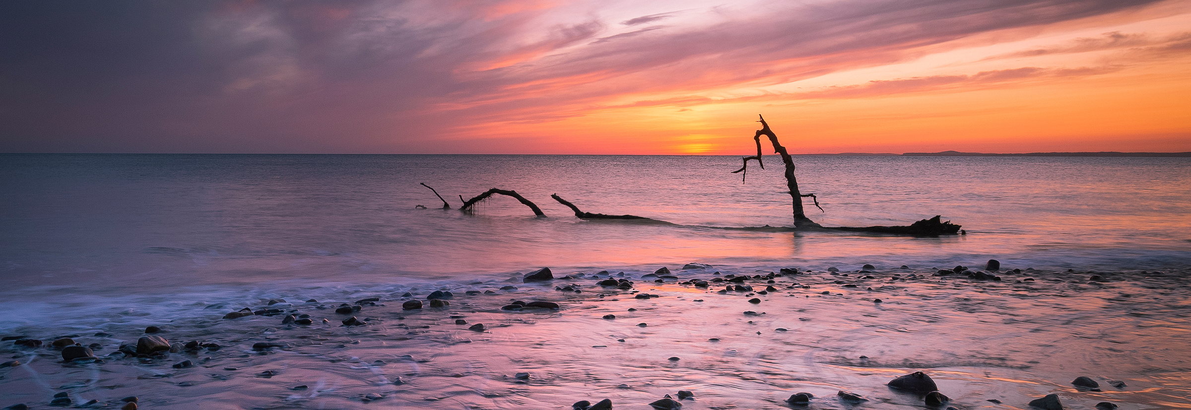 Sunset over the beach and dunes on the Glamorgan coast