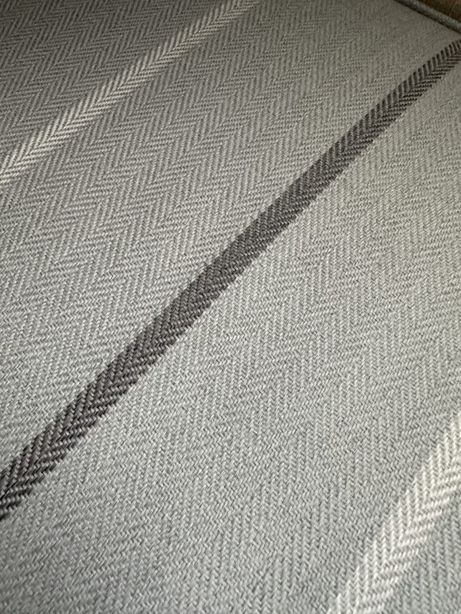 The Glendale, a herringbone throw over the arm of the sofa