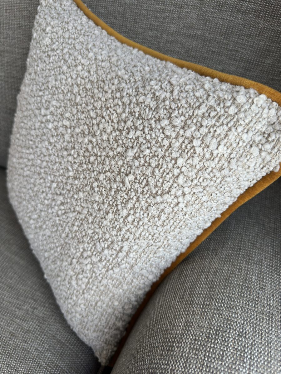 The Margaux, a boucl&eacute; cushion trimmed in mustard