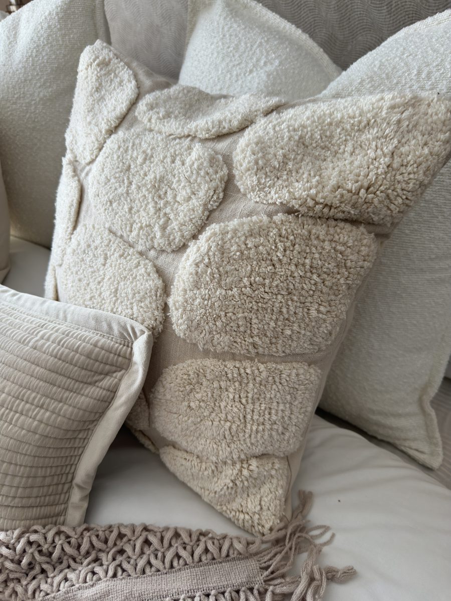 The Salisbury, boucl&eacute; cushions on the bed
