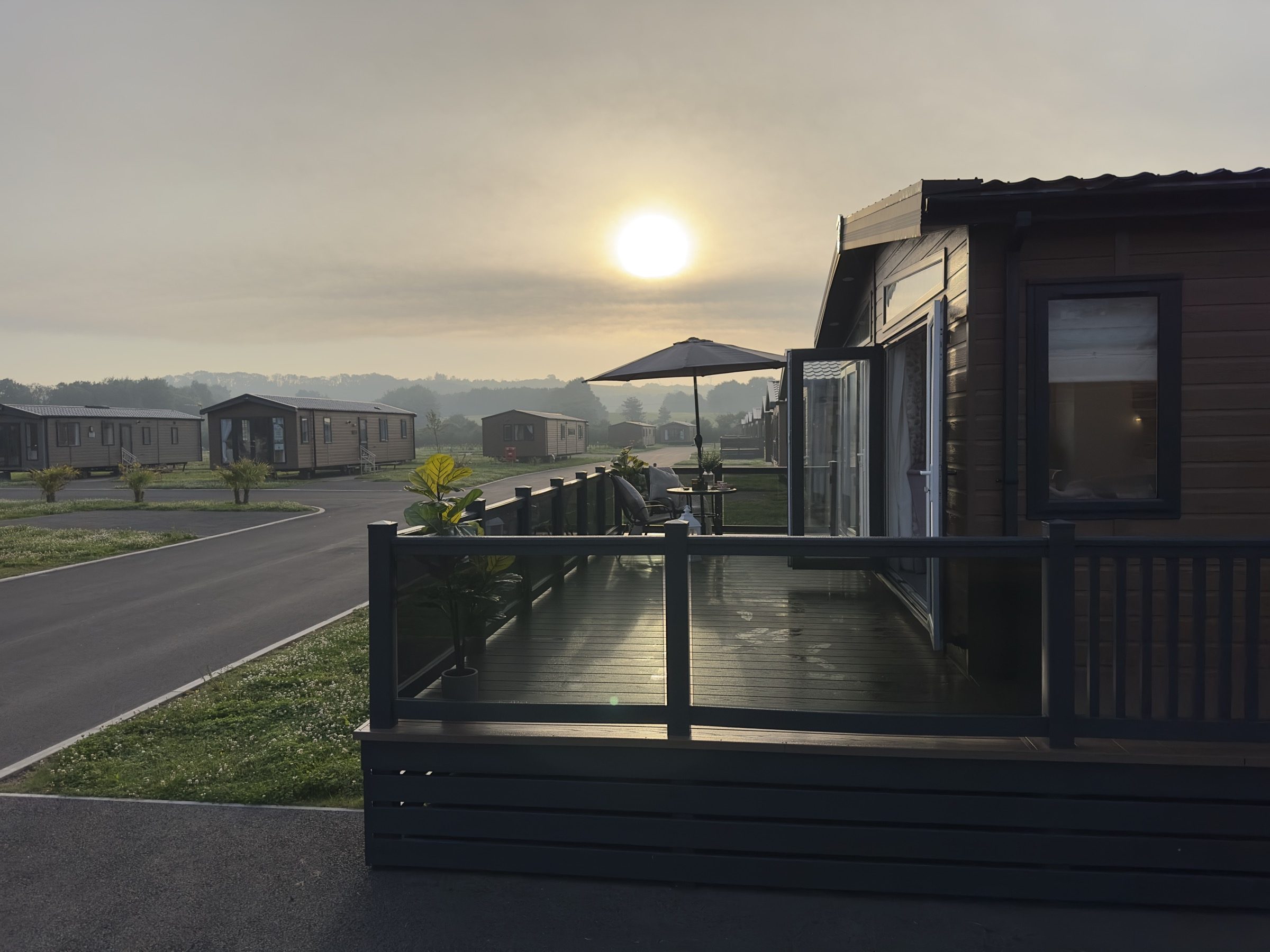 Early morning over Nottage Park Lodges, seen from the decking of a lodge