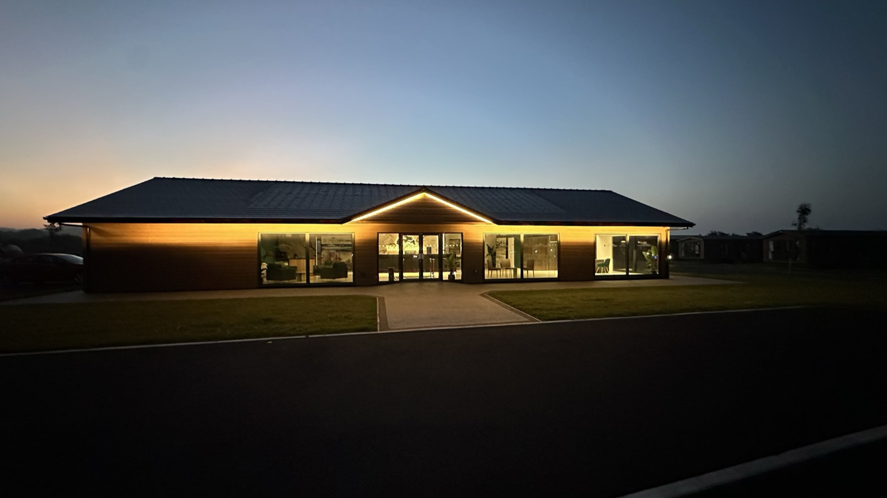 Reception at Nottage Park Lodges, lit at dusk